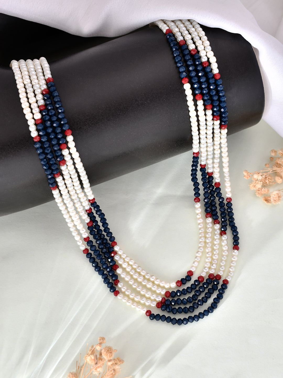 this beautiful long Layered pearl necklace is the perfect accessory for any woman or girl. The exquisite design and handcrafted details make it a timeless piece that will elevate any outfit. Add a touch of elegance and sophistication to your look with this stunning necklace.