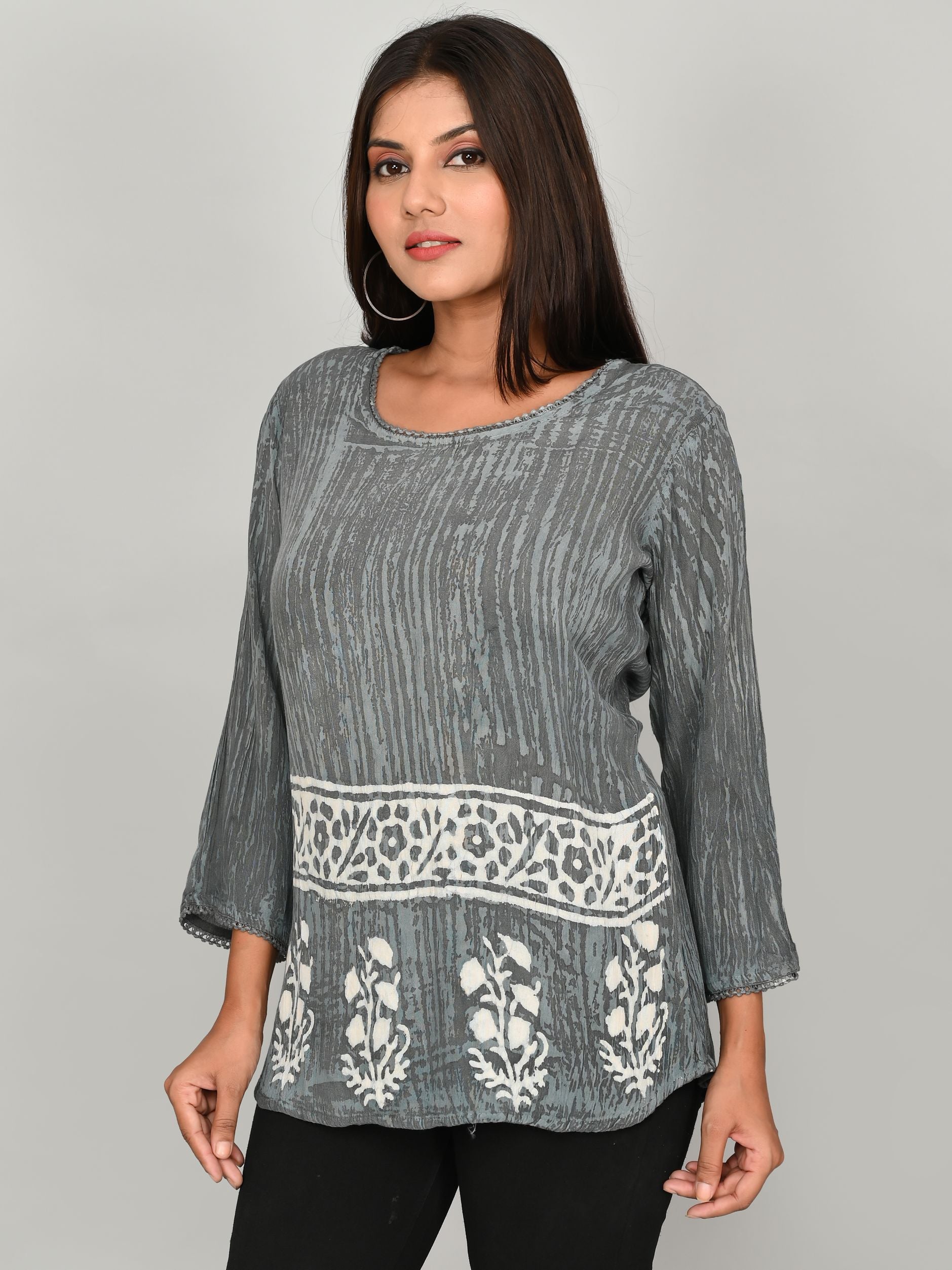 Made from luxurious grey silk crepe, this printed casual top is the perfect addition to any girls' or women's wardrobe. The soft and lightweight material provides both comfort and style, making this top perfect for everyday wear. Its unique print adds a touch of elegance to any outfit.