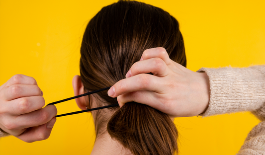 a Women is tying her hair