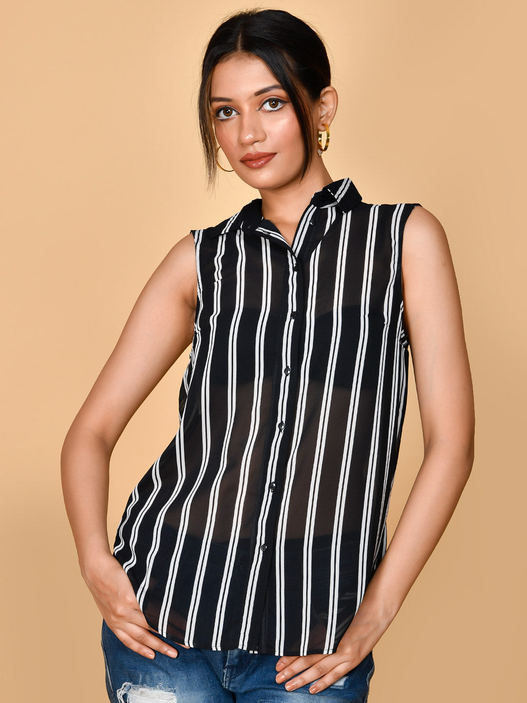 This Georgette Striped Sleeveless Shirt Top is a stylish and versatile addition to any wardrobe. Made from high-quality georgette, it offers lightweight and breathable comfort. The timeless striped design adds a touch of sophistication, making it perfect for both girls and women. Stay cool and classy in this must-have top.