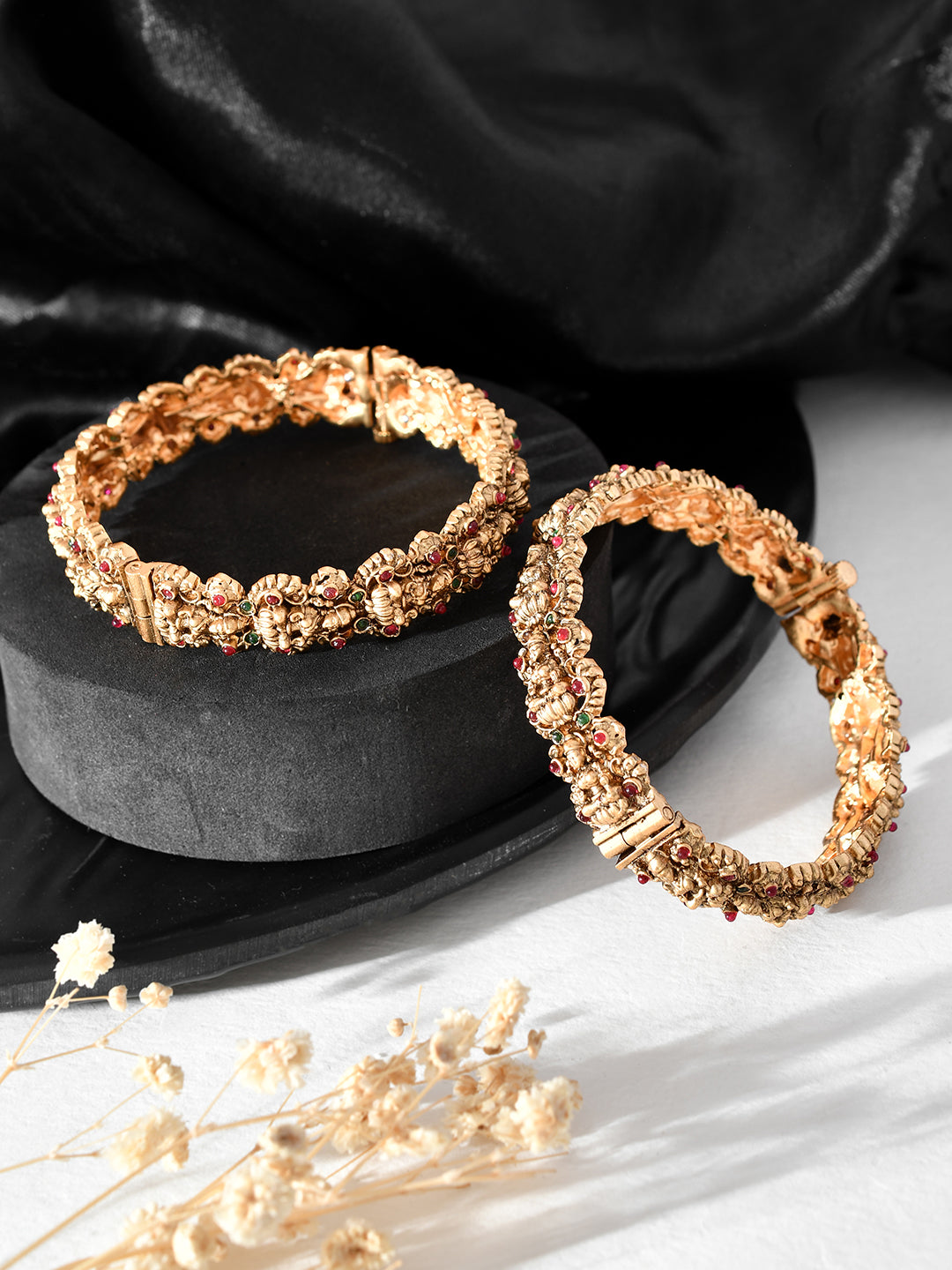 Elevate your style with our South Indian Traditional Temple Bangle Style Gold Plated Bracelet for women. Expertly crafted with stunning details, this bracelet is the perfect accessory for any attire. Made from high-quality materials, it is built to last and add a touch of elegance to your look.