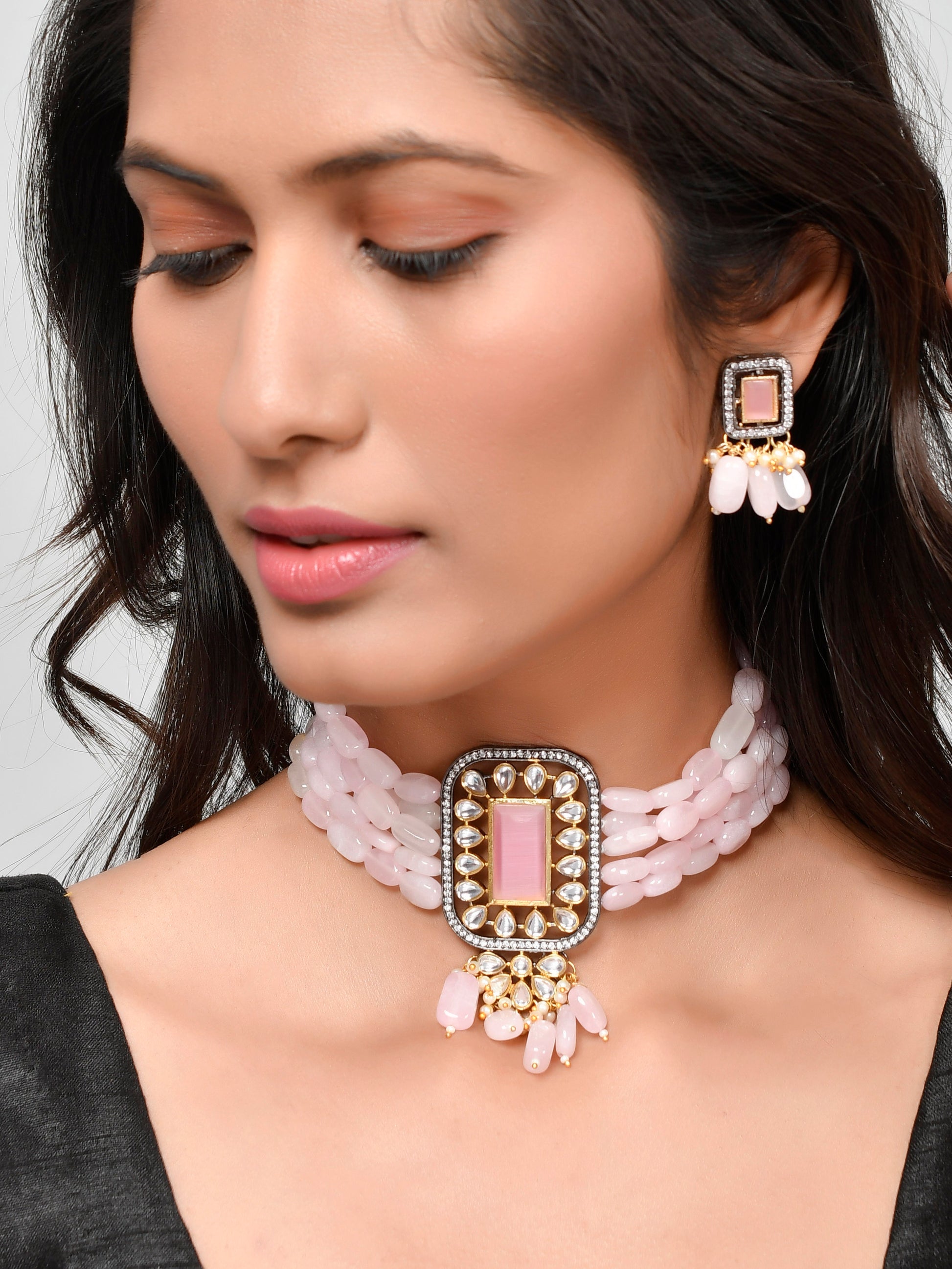 Shop This stunning handcrafted pink beaded kundan Choker jewellery set is the perfect addition to any woman or girl's collection. Made with intricate detail and high-quality materials, this set exudes elegance and sophistication.