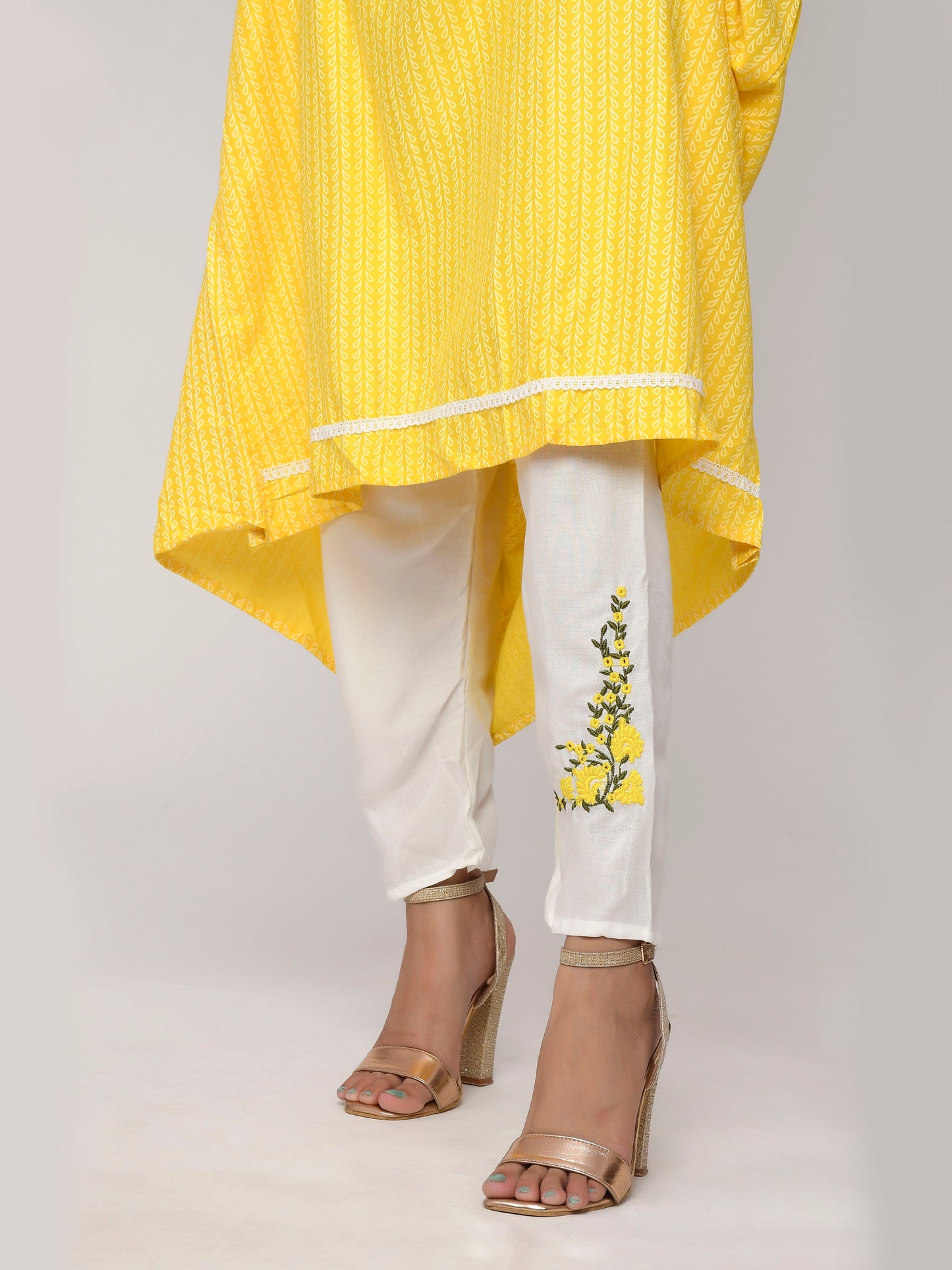 Yellow and White Colored Printed Kurta With Trouser.