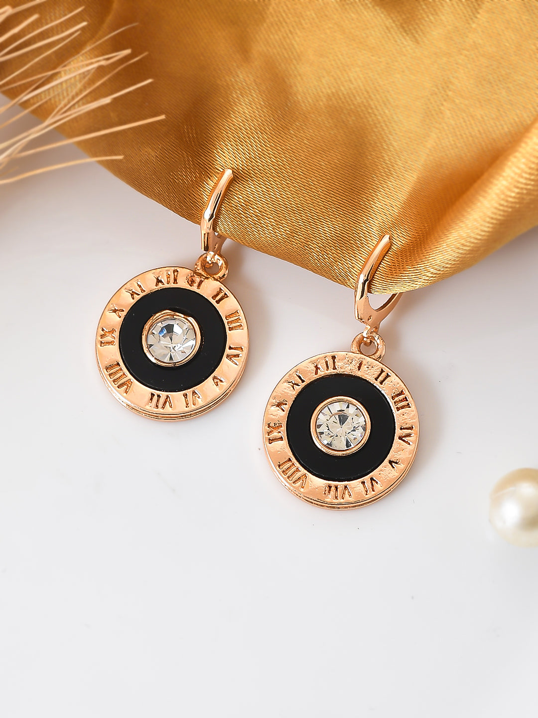 rose gold hoop earrings with white zircons and black enamel