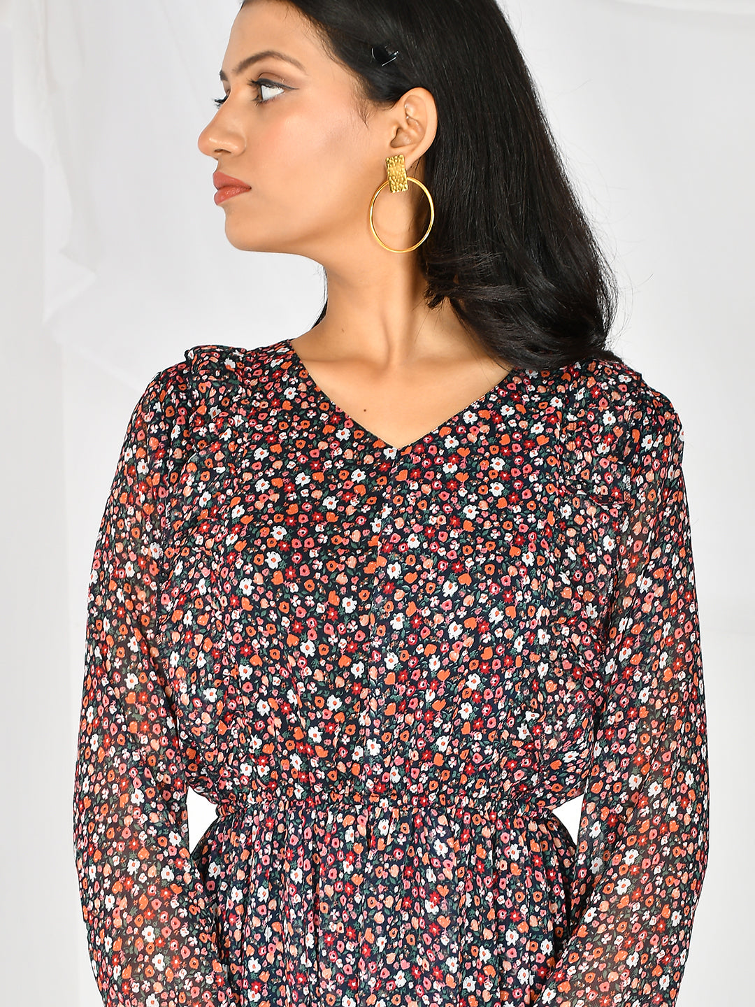 Flaunt your style with the Floral Printed V-Neck Knee Length Western Dress. The delicate floral print and v-neck design add a touch of femininity to this dress, making it the perfect choice for any occasion. Its knee-length cut ensures a flattering fit while keeping you comfortable all day long.